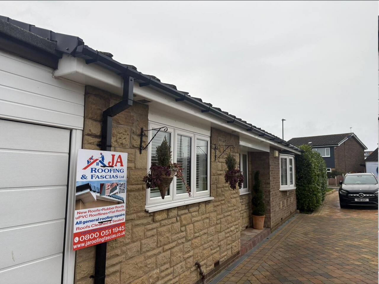 Freshly installed black UPVC fascias, soffits and guttering on a Doncaster bungalow by JA Roofing